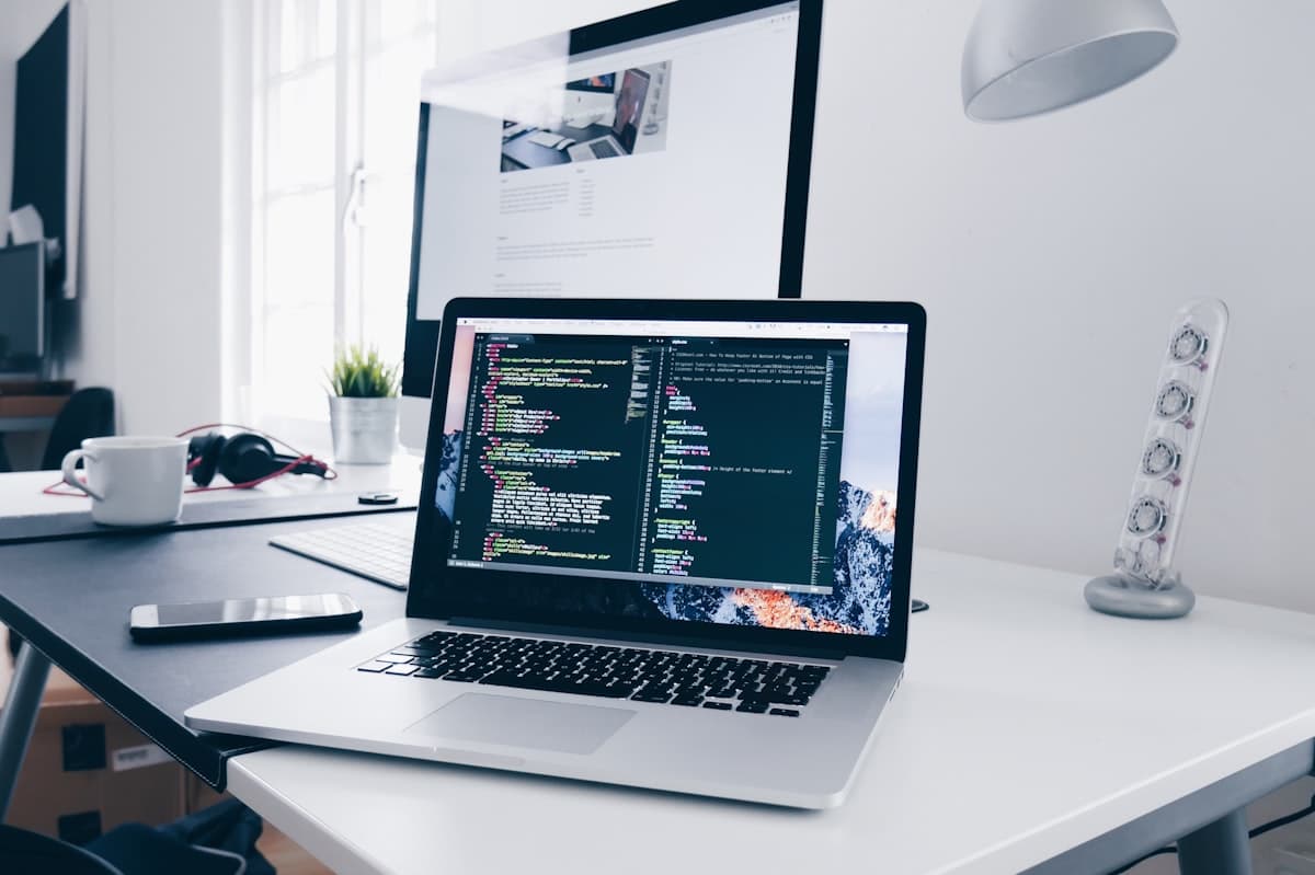 Developer workspace with code on a laptop screen